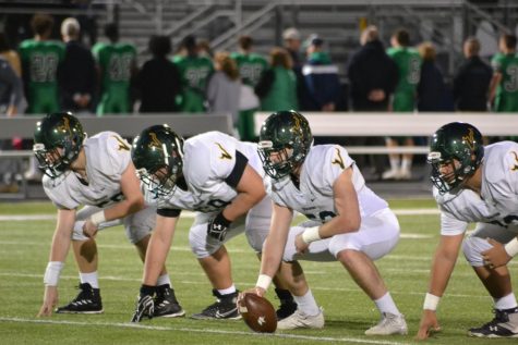 Valley Viking Football players ready to snap the ball