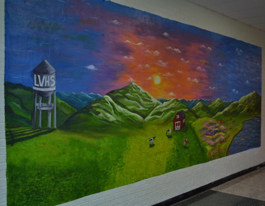 a mural by Jaclynne Gallman, Megan Mercuro, and Chloe Wakefield at the start of the science hall.
