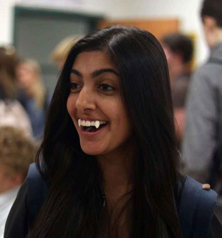 Pooja Kaushal smiles as her fangs fiercely come out of her teeth for the second day of spirit week.