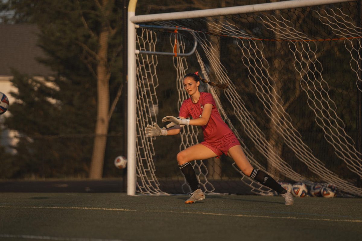 Lizzie Thornton dives to make a save during  a game against Heritage April,29. The game ended in a 3-1 win for Valley. 