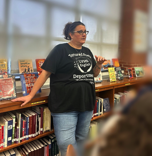 Mrs. Perry teaching a class in the library