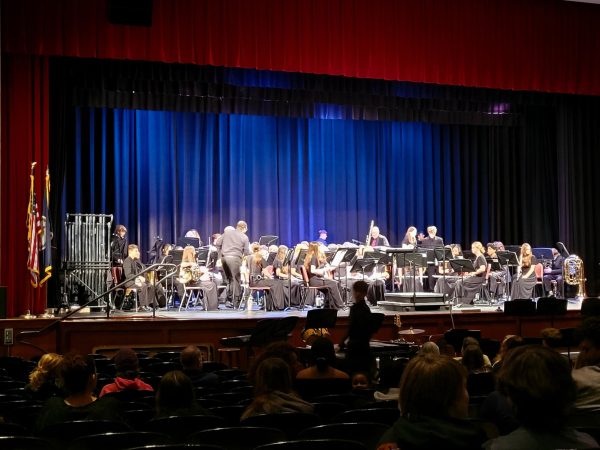 The concert band takes the stage for their winter concert. 