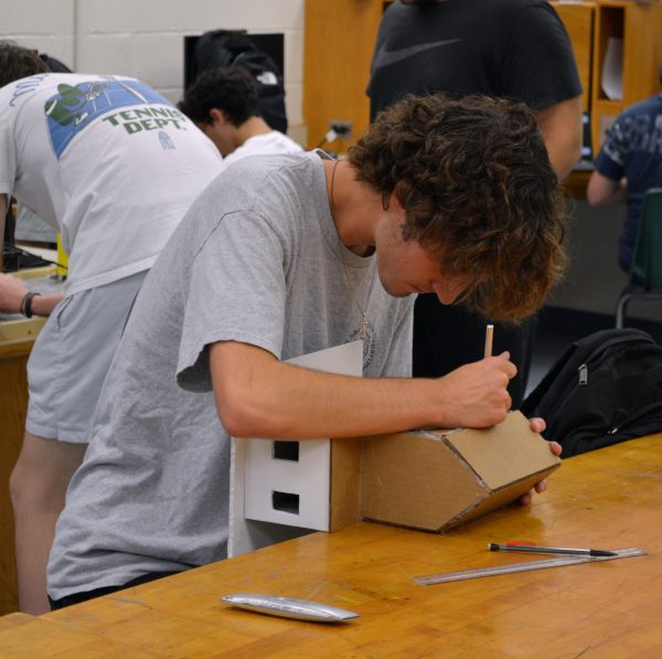 Junior Tucker Egee building in a civil engineering class